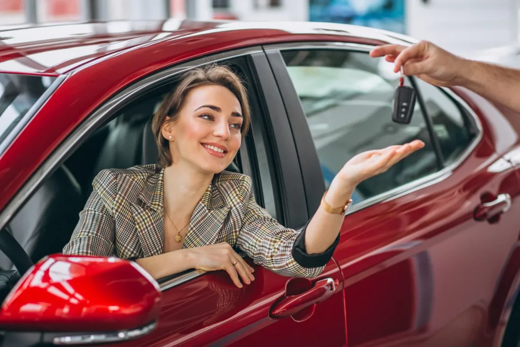 woman-sitting-red-car-receiving-keys_1303-14094.jpg